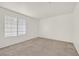 Bedroom featuring neutral carpeting, a ceiling fan, and a window with blinds at 510 Crumpler Pl, Henderson, NV 89052