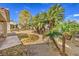 A private backyard with desert landscaping and scattered shade at 5216 Las Cruces Dr, Las Vegas, NV 89130