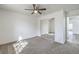 Bedroom with carpet flooring, ceiling fan, and closet with mirrored doors at 5216 Las Cruces Dr, Las Vegas, NV 89130