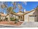 Inviting single-story home boasting a tidy yard, mature trees, and a convenient attached garage at 5216 Las Cruces Dr, Las Vegas, NV 89130