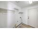 Clean and well-lit laundry room with a door to the exterior at 5216 Las Cruces Dr, Las Vegas, NV 89130