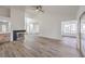 Spacious living room featuring wood flooring, a modern ceiling fan, and stylish fireplace at 5216 Las Cruces Dr, Las Vegas, NV 89130