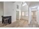 Bright living room featuring a fireplace, wood-style flooring, and high ceilings at 5216 Las Cruces Dr, Las Vegas, NV 89130