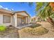 Covered patio area off home with privacy wall and desert landscaping at 5216 Las Cruces Dr, Las Vegas, NV 89130