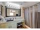 This bathroom has custom vanity, black hardware and large framed mirror at 524 Turtleback Rd # A, Mesquite, NV 89027