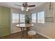 Bright breakfast nook features plantation shutters, a ceiling fan, and modern furnishings at 524 Turtleback Rd # A, Mesquite, NV 89027