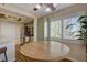 Breakfast nook with stainless appliances, olive green cabinets and plantation shutters on windows at 524 Turtleback Rd # A, Mesquite, NV 89027