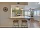 View of the kitchen and breakfast bar with seating, opening up to a breakfast nook at 524 Turtleback Rd # A, Mesquite, NV 89027