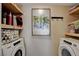 Efficient laundry room featuring modern appliances and shelving for organized storage solutions at 524 Turtleback Rd # A, Mesquite, NV 89027