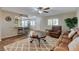 The living room features hardwood flooring, a ceiling fan, and a breakfast bar into the kitchen at 524 Turtleback Rd # A, Mesquite, NV 89027