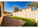 Backyard features artificial turf and a brick-paved patio at 5575 Cresent Valley St, Las Vegas, NV 89148