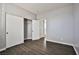 Neutral bedroom with wood-look floors, bright light, and closet space at 5575 Cresent Valley St, Las Vegas, NV 89148