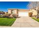 Charming single-story home features a two-car garage, manicured lawn, and desert landscaping at 5575 Cresent Valley St, Las Vegas, NV 89148