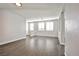 Spacious living room features wood-look tile floors and natural light, ideal for relaxing at 5575 Cresent Valley St, Las Vegas, NV 89148