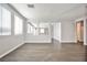 Bright living area with wood-look tile floors, recessed lighting, and an open floor plan at 5575 Cresent Valley St, Las Vegas, NV 89148