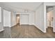 Spacious open-plan living area with modern wood-look tile flooring, neutral paint, and recessed lighting at 5575 Cresent Valley St, Las Vegas, NV 89148