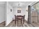 Cozy dining area with a modern light fixture and sliding glass doors leading to the patio at 5640 Vasila Dr, Las Vegas, NV 89110