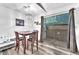 Cozy dining area with a modern light fixture and sliding glass doors leading to the patio at 5640 Vasila Dr, Las Vegas, NV 89110