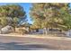 Charming single-story home featuring mature trees and a well-maintained front yard at 5640 Vasila Dr, Las Vegas, NV 89110