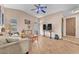 Well-lit living room features neutral walls, tile floors, and modern furnishings at 5640 Vasila Dr, Las Vegas, NV 89110