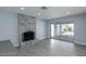 Cozy living room with a modern fireplace and sliding glass doors leading to the backyard at 5816 W Cherokee Ave, Las Vegas, NV 89103