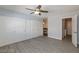 Spacious bedroom features a ceiling fan, modern flooring and adjacent makeup vanity at 5816 W Cherokee Ave, Las Vegas, NV 89103