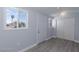 Bright shed interior features gray vinyl flooring, closet, and a window with a view at 5816 W Cherokee Ave, Las Vegas, NV 89103