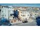 Aerial view of modern three-story townhomes featuring balconies, landscaping, and garages at 639 Grey Saker St, Las Vegas, NV 89138