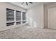 Bright bedroom featuring ample natural light from large windows with roller shades and a neutral carpet at 639 Grey Saker St, Las Vegas, NV 89138