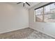 This bedroom features neutral walls, plush carpet, and a modern ceiling fan for a comfortable living space at 639 Grey Saker St, Las Vegas, NV 89138