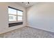 A bright bedroom featuring neutral walls, plush carpet and a large window at 639 Grey Saker St, Las Vegas, NV 89138