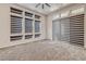 Bright, carpeted bedroom featuring multiple windows and a sliding glass door with horizontal blinds at 639 Grey Saker St, Las Vegas, NV 89138