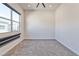 A bright bedroom featuring neutral walls, plush carpet and large window at 639 Grey Saker St, Las Vegas, NV 89138