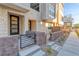 Inviting townhome entrance with modern door, stone facade, and landscaped walkway at 639 Grey Saker St, Las Vegas, NV 89138