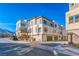 Contemporary three-story townhouse showcasing modern architecture and a community street at 639 Grey Saker St, Las Vegas, NV 89138