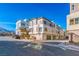 Contemporary three-story townhouse showcasing modern architecture and a community street at 639 Grey Saker St, Las Vegas, NV 89138