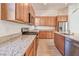 Well-lit kitchen featuring granite counters, stainless steel appliances, and ample cabinet space at 639 Grey Saker St, Las Vegas, NV 89138