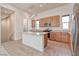 Well-lit kitchen with granite countertops, stainless steel appliances, and modern light fixtures at 639 Grey Saker St, Las Vegas, NV 89138