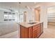 Kitchen island with stainless steel appliances overlooks living room at 639 Grey Saker St, Las Vegas, NV 89138