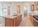 Kitchen island view shows stainless steel appliances, granite countertops, and walk-in pantry at 639 Grey Saker St, Las Vegas, NV 89138