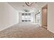 Spacious living room with ceiling fan, many windows, and sliding glass doors at 639 Grey Saker St, Las Vegas, NV 89138