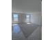 Bright bedroom with neutral carpet and many windows at 6616 Bowery St, Las Vegas, NV 89148