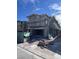 New construction home featuring a garage, scaffolding, and construction materials in the front yard at 6616 Bowery St, Las Vegas, NV 89148