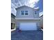 Charming two-story home featuring a two-car garage and stone accents for added curb appeal at 6616 Bowery St, Las Vegas, NV 89148