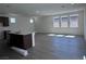 Bright living room with wood-look flooring and many windows at 6616 Bowery St, Las Vegas, NV 89148