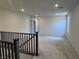 Open loft area with neutral carpeting and lots of natural light at 6616 Bowery St, Las Vegas, NV 89148