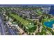 Panoramic aerial view showcasing a golf course, lush landscaping, and a lake at 668 Oakmont Ave # 1724, Las Vegas, NV 89109