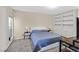 Relaxing bedroom featuring a queen bed, built-in bookcase, and lots of natural light at 668 Oakmont Ave # 1724, Las Vegas, NV 89109