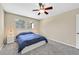 Serene bedroom featuring a queen bed with two windows that provide ample natural light at 668 Oakmont Ave # 1724, Las Vegas, NV 89109