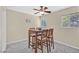 This dining area is a cozy space for enjoying meals with a table, chairs and natural light at 668 Oakmont Ave # 1724, Las Vegas, NV 89109